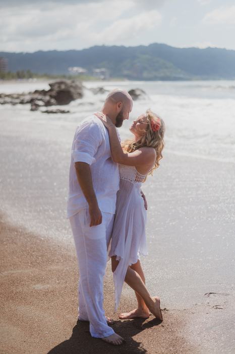 Pamela leaning into Tanner on the beach