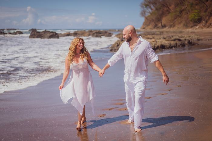 Pamela and Tanner walking the shoreline
